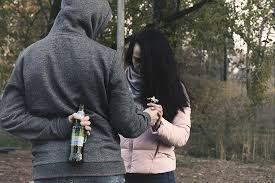 man carrying a beer